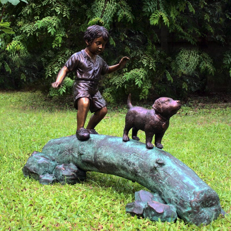 Boy Following Dog Across Log Brass Baron Outdoor Statue - Outdoorartpross